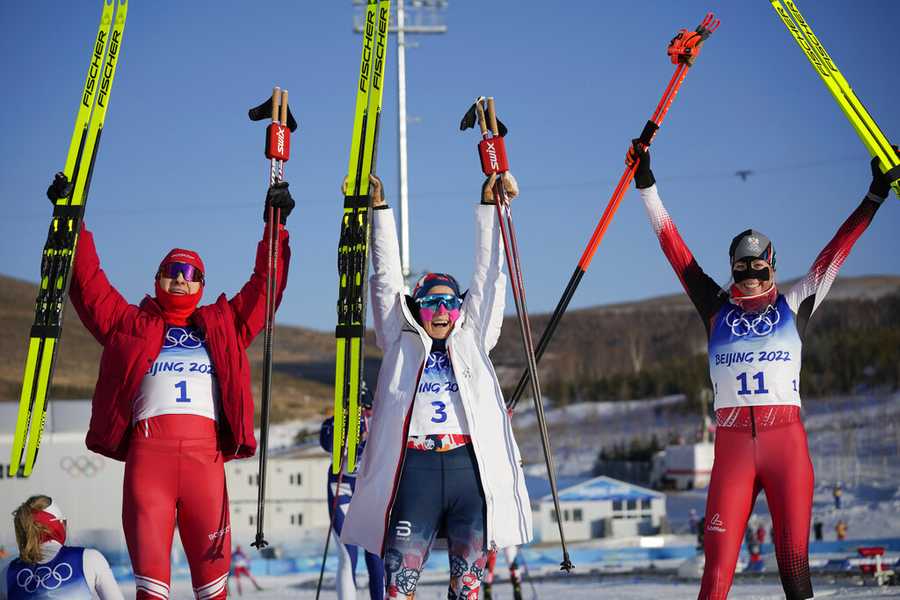 Cross-country skiing From left, silver medal finisher Russian athlete Natalia Nepryaeva, gold medal finisher Norway's Therese Johaug and bronze medal finisher Austria's Teresa Stadlober celebrate after the women's 7.5km + 7.5km skiathlon cross-country skiing competition at the 2022 Winter Olympics, Saturday, Feb. 5, 2022, in Zhangjiakou, China. (AP Photo/Aaron Favila)