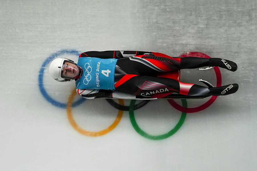 Luge Makena Hodgson, of Canada, slides during a luge women's training run at the 2022 Winter Olympics, Saturday, Feb. 5, 2022, in the Yanqing district of Beijing. (AP Photo/Pavel Golovkin)