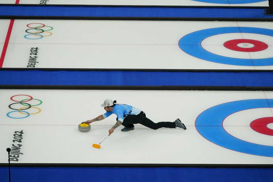 Curling Christopher Plys, of the United States, during the mixed doubles curling match against China at the Beijing Winter Olympics Saturday, Feb. 5, 2022, in Beijing. (AP Photo/Brynn Anderson)