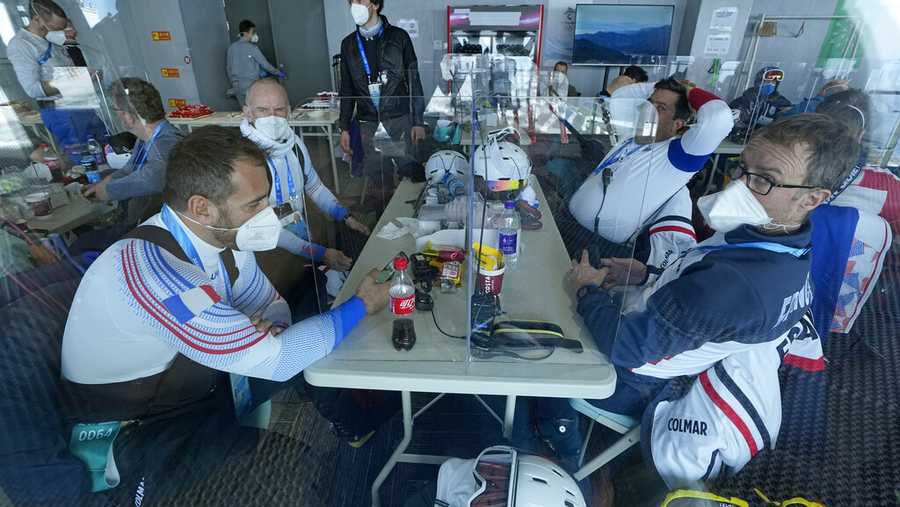 Ski racers wait in the athletes lounge near the top of the course during a delay in the start of the men&apos;s downhill due to high winds at the 2022 Winter Olympics, Sunday, Feb. 6, 2022, in the Yanqing district of Beijing. (AP Photo/Robert F. Bukaty)