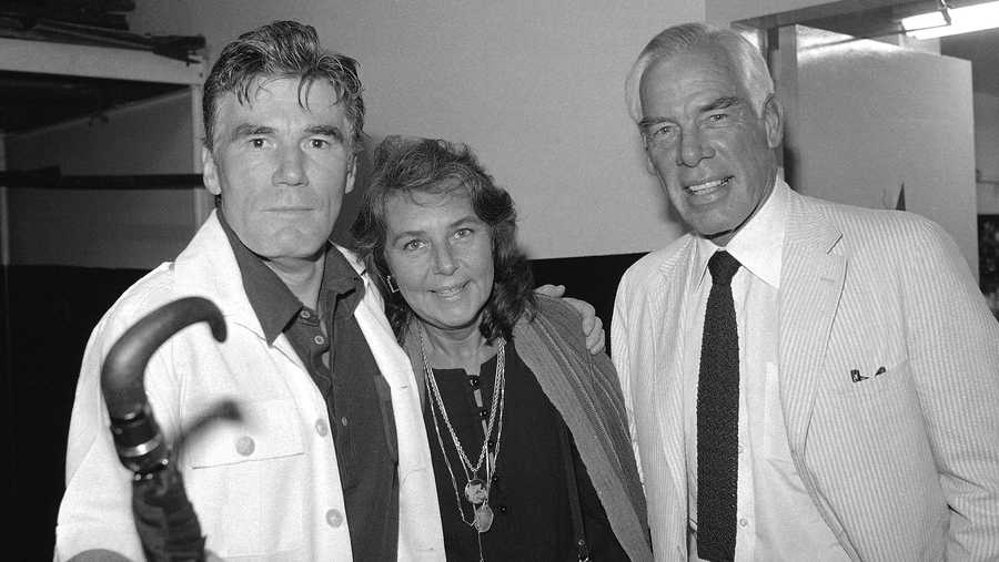 FILE - Actor Lee Marvin, right, and his wife, Pamela, visit with Mitchell Ryan, star of Arthur Miller&apos;s play "The Price," backstage at the Playhouse Theater in New York in July 1979. Ryan, who played a villainous general in the first “Lethal Weapon" movie, a ruthless businessman on TV&apos;s “Santa Barbara" and had character roles on the soap opera “Dark Shadows" and the 1990s sitcom “Dharma & Greg," died Friday, March 4, 2022. He was 88. Ryan died of congestive heart failure at his Los Angeles home, his stepdaughter, Denise Freed, told the Hollywood Reporter.