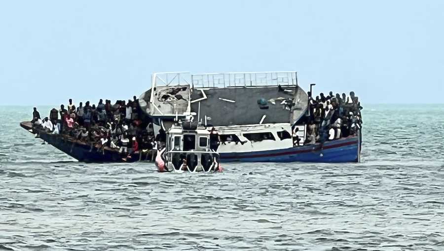 This photo provided by the United States Border Patrol shows a boat that ran aground in the Florida Keys off Key Largo on Sunday, March 6, 2022. A wooden boat carrying hundreds of Haitian migrants in a suspected human smuggling operation ran aground in shallow water in the Florida Keys, where 163 people swam ashore and many needed medical attention, federal authorities said. (United States Border Patrol via AP)
