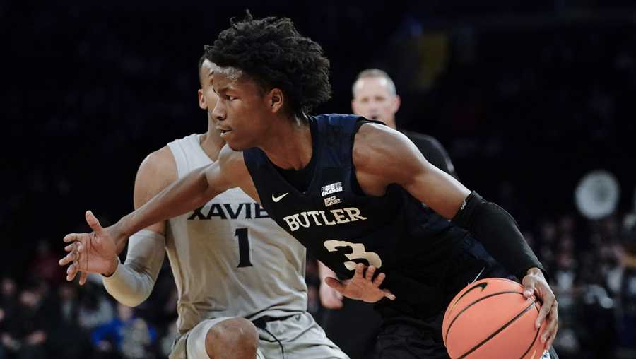 Butler's Chuck Harris (3) drives past Xavier's Paul Scruggs (1) during the second half of an NCAA college basketball game at the Big East basketball tournament Wednesday, March 9, 2022, in New York. (AP Photo/Frank Franklin II)