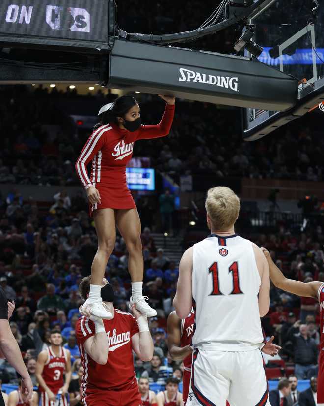 A Louisville cheerleader during the NCAA College Basketball game