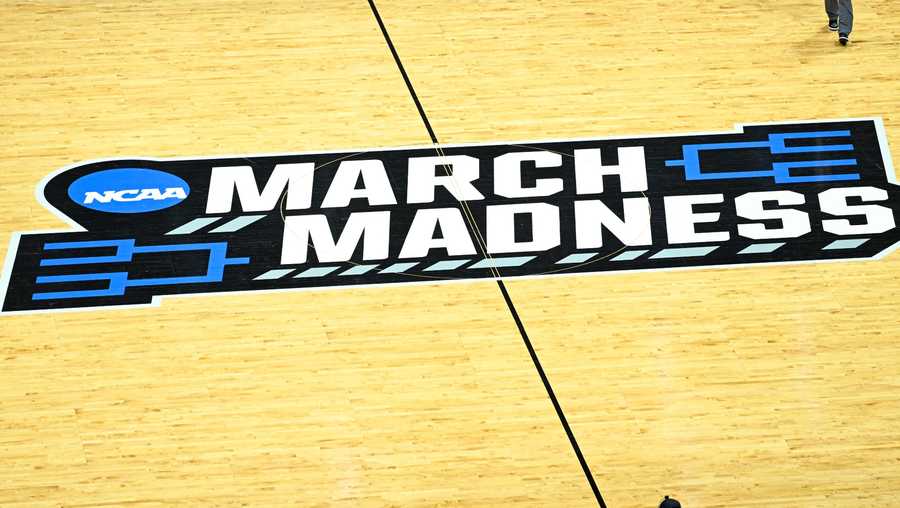 The March Madness logo is shown on the court during a break in a first-round NCAA college basketball tournament game between Arizona and Wright State, Friday, March 18, 2022, in San Diego.