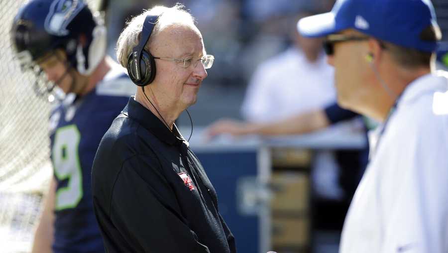 FILE - John Clayton, an NFL football writer and reporter for ESPN, stands on the sideline during an NFL football game between the Seattle Seahawks and the San Francisco 49ers, Sunday, Sept. 25, 2016, in Seattle. (AP Photo/Ted S. Warren, File)