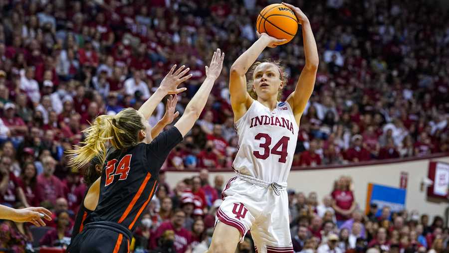 Indiana guard Grace Berger (34) shoots over Princeton guard Julia Cunningham (24) in the second half of a college basketball game in the second round of the NCAA tournament in Bloomington, Ind., Monday, March 21, 2022. Indiana defeated Princeton 56-55. (AP Photo/Michael Conroy)
