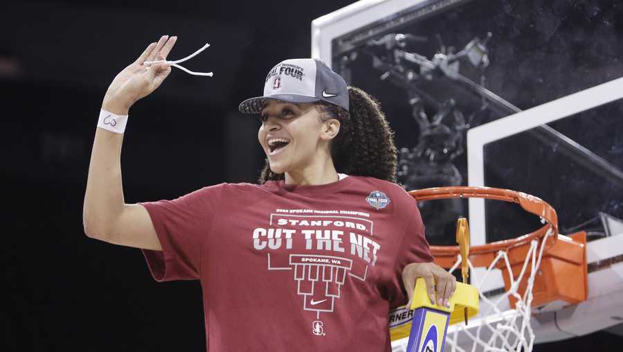 Stanford guard Haley Jones cuts down the net after the team&apos;s 59-50 win in a college basketball game in the Elite 8 round of the NCAA tournament against Texas, Sunday, March 27, 2022, in Spokane, Wash. (AP Photo/Young Kwak)