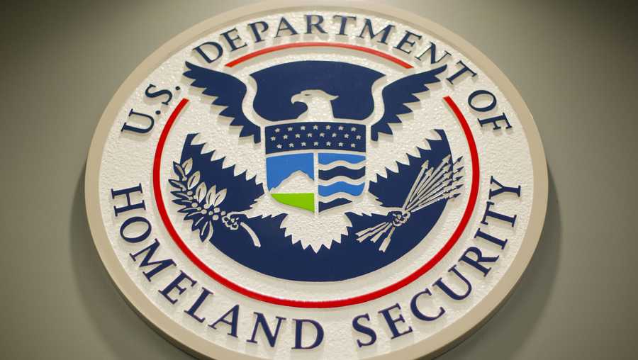 The Homeland Security logo is seen during a joint news conference in Washington, Feb. 25, 2015. The Homeland Security Department said Friday that Cameroonians would be temporarily shielded from deportation, saying extreme violence between government forces and armed separatists in the African nation made conditions unsafe for people to return.