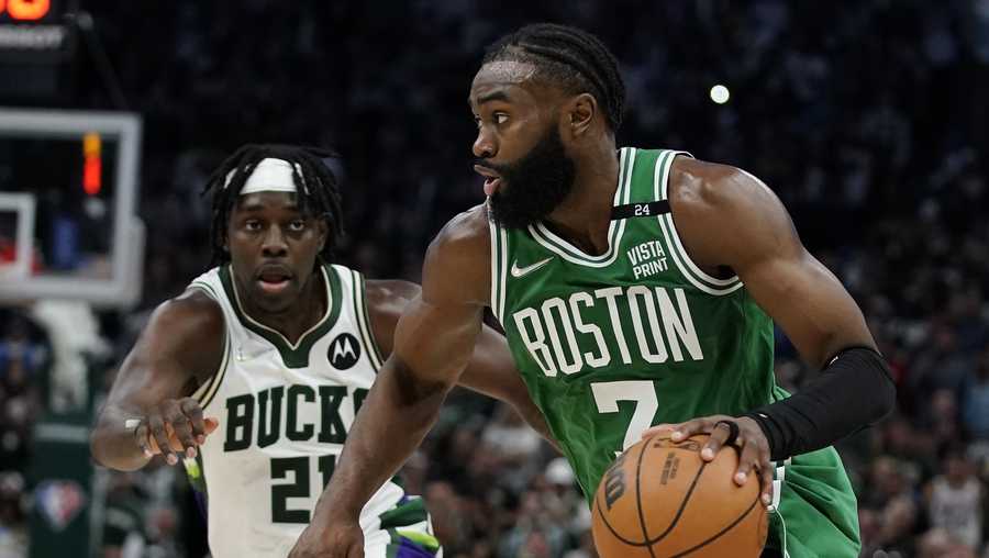 Boston Celtics Jaylen Brown tries to drive past Milwaukee Bucks Jrue Holiday during the second half of Game 3 of an NBA basketball Eastern Conference semifinals playoff series Saturday, May 7, 2022, in Milwaukee. The Bucks won 103-101 to take a 2-1 lead in the series. (AP Photo/Morry Gash)