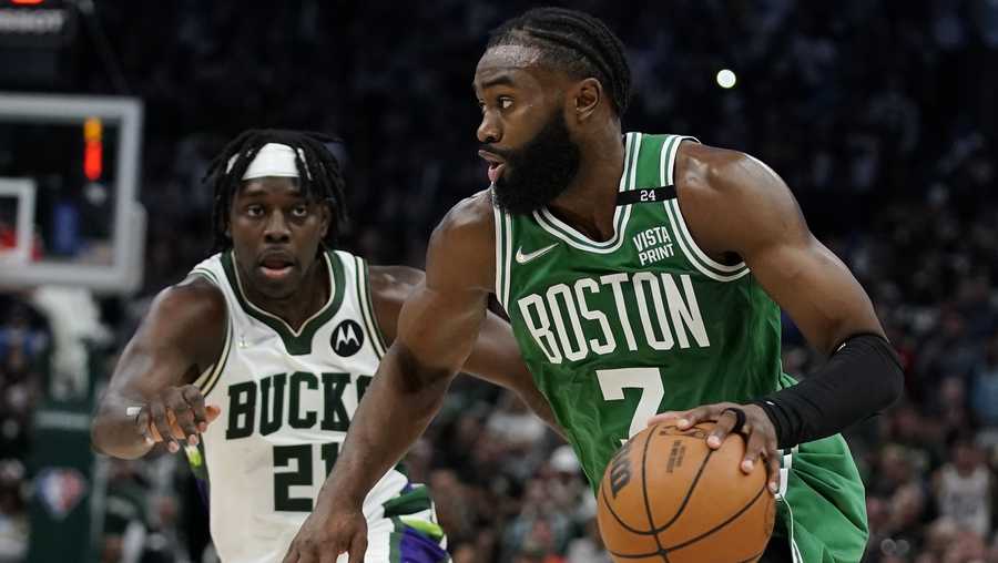 Boston Celtics Jaylen Brown tries to drive past Milwaukee Bucks Jrue Holiday during the second half of Game 3 of an NBA basketball Eastern Conference semifinals playoff series Saturday, May 7, 2022, in Milwaukee. The Bucks won 103-101 to take a 2-1 lead in the series. (AP Photo/Morry Gash)
