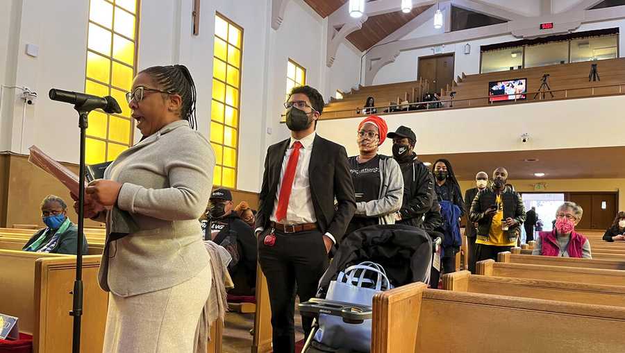 FILE - People line up to speak during a reparations task force meeting at Third Baptist Church in San Francisco on April 13, 2022.  A report by California&apos;s first in the nation task force on reparations Wednesday, June 1 will document in detail the harms perpetuated by the state against Black people and recommend ways to address those wrongs. (AP Photo/Janie Har, File)