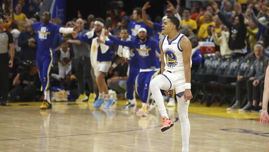 Golden State Warriors guard Jordan Poole (3) celebrates after scoring against the Boston Celtics during the second half of Game 1 of basketball&apos;s NBA Finals in San Francisco, Sunday, June 5, 2022. (AP Photo/Jed Jacobsohn)