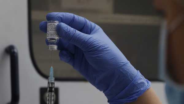 FILE - A vial of the Phase 3 Novavax coronavirus vaccine is seen ready for use in the trial at St. George's University hospital in London, Oct. 7, 2020. The Novavax COVID-19 vaccine that could soon win federal approval may offer a boost for the U.S. military: an opportunity to get shots into some of the thousands of service members who have refused the vaccine for religious reasons.