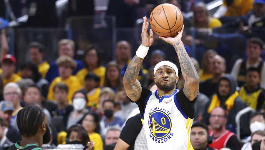 Golden State Warriors guard Gary Payton II (0) shoots against the Boston Celtics during the first half of Game 5 of basketball&apos;s NBA Finals in San Francisco, Monday, June 13, 2022. (AP Photo/Jed Jacobsohn)