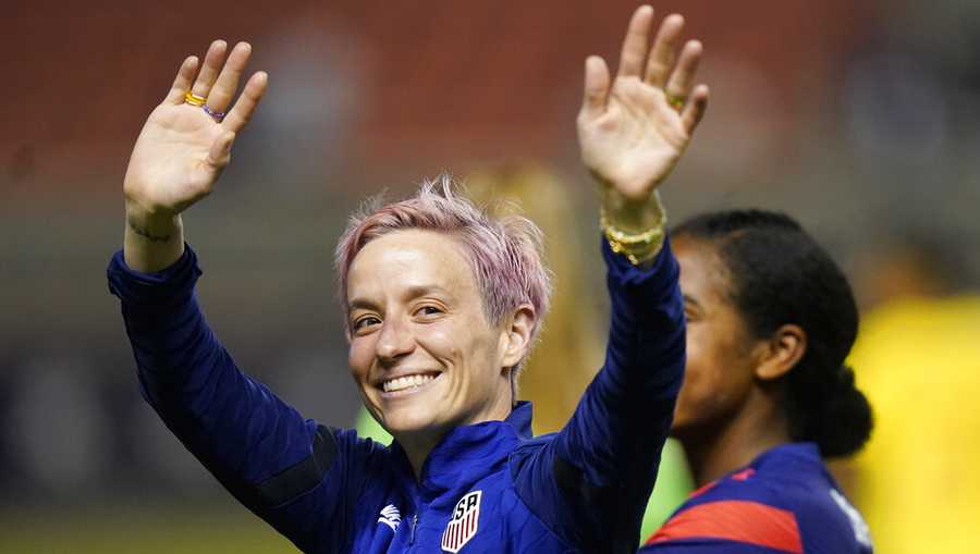 FILE - Megan Rapinoe waves to fans following the team&apos;s international friendly soccer match against Colombia, June 28, 2022, in Sandy, Utah. President Joe Biden will present the nation’s highest civilian honor, the Presidential Medal of Freedom, to 17 people, at the White House next week. (AP Photo/Rick Bowmer, File)