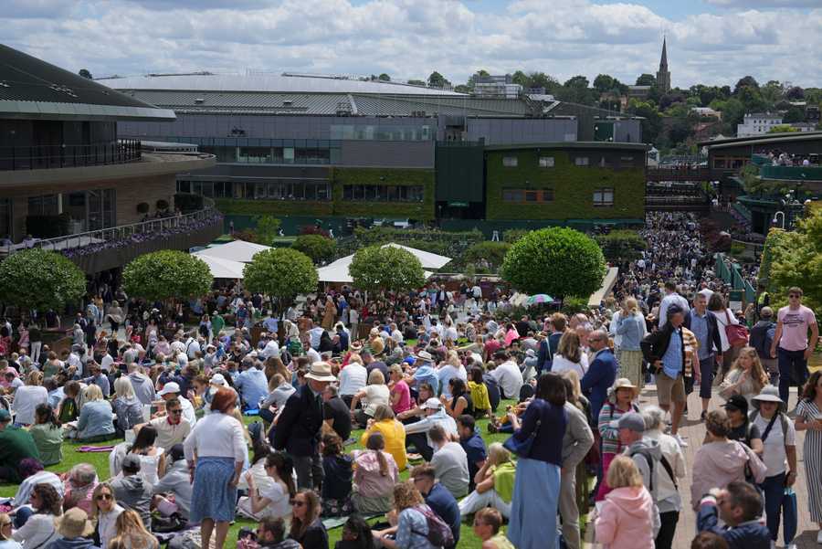Wimbledon Tennis Week One Photo Gallery Crowds flock on the Hill outside court one on day two of the Wimbledon tennis championships in London, Tuesday, June 28, 2022.