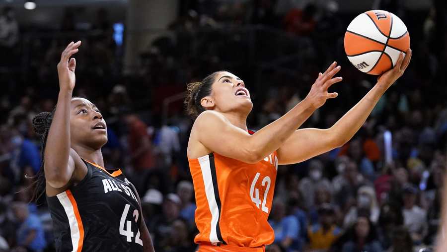 Team Wilson&apos;s Kelsey Plum, right, drives to the basket past Team Stewart&apos;s Jewell Loyd during the second half of a WNBA All-Star basketball game in Chicago, Sunday, July 10, 2022. (AP Photo/Nam Y. Huh)