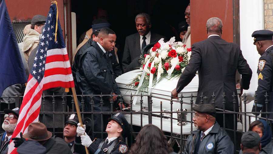 FILE - A color guard readies their flags as pallbearers carry the remains of token clerk Harry Kaufman after funeral services, in the Brooklyn borough of New York, Wednesday, Dec, 13, 1995. Kaufman died after suffering burns over 70 percent of his body in a subway token booth torching incident. Prosecutors are disavowing the convictions of three men who spent decades in prison for one of the most horrifying crimes of New York&apos;s violent 1990s — the killing of a clerk who was set on fire in a subway toll booth. (AP Photo/Kathy Willens, File)