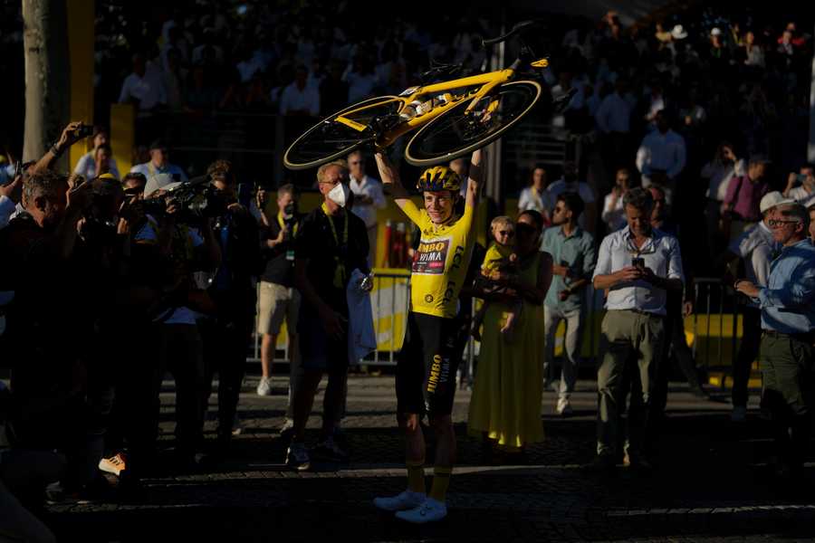 Tour de France winner Denmark's Jonas Vingegaard, wearing the overall leader's yellow jersey, celebrates after the twenty-first stage of the Tour de France cycling race over 116 kilometers (72 miles) with start in Paris la Defense Arena and finish on the Champs Elysees in Paris, France, Sunday, July 24, 2022.