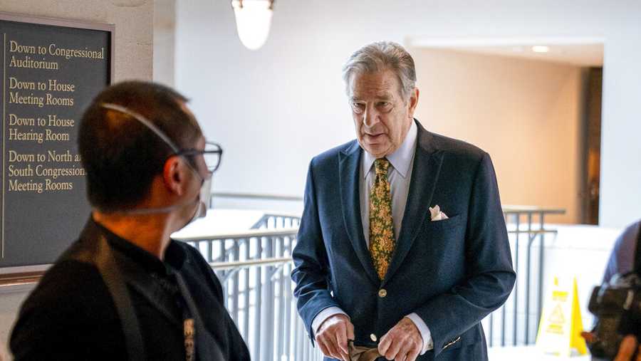 FILE - Paul Pelosi, right, the husband of House Speaker Nancy Pelosi, of California, follows his wife as she arrives for her weekly news conference on Capitol Hill in Washington on March 17, 2022. Pelosi pleaded not guilty Wednesday, Aug. 3, to misdemeanor driving under the influence charges related to a May car crash in Northern California wine country. Paul Pelosi did not appear in person at Napa County Superior Court. (AP Photo/Andrew Harnik, File)
