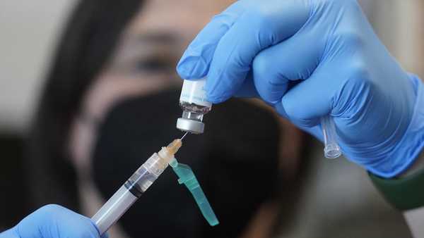 FILE - A registered nurse prepares a dose of a monkeypox vaccine at the Salt Lake County Health Department in Salt Lake City on July 28, 2022. The Biden administration said Friday, Aug. 26, 2022, that it has shipped enough monkeypox vaccine to deliver the first of two doses to all of the 1.6 million people identified to be at highest risk of infection from the virus. (AP Photo/Rick Bowmer, File)