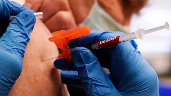 FILE - A pharmacist injects a patient with a booster dosage of the Moderna COVID-19 vaccine at a vaccination clinic in Lawrence, Mass., on Wednesday, Dec. 29, 2021. U.S. regulators have authorized updated COVID-19 boosters, the first to directly target today's most common omicron strain. The move on Wednesday, Aug. 13, 2022, by the Food and Drug Administration tweaks the recipe of shots made by Pfizer and rival Moderna that already have saved millions of lives.