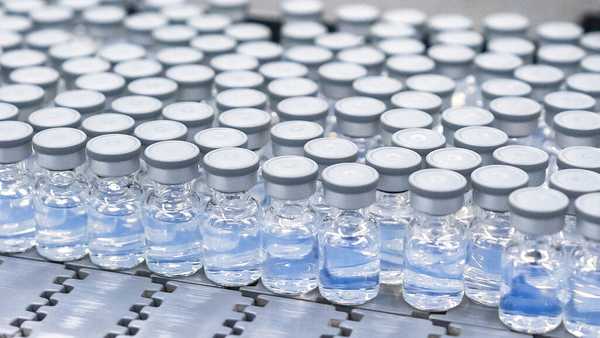 This August 2022 photo provided by Pfizer shows vials of the company's updated COVID-19 vaccine during production in Kalamazoo, Mich.