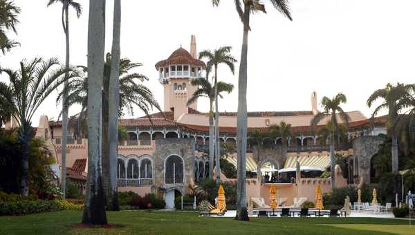 FILE - President Donald Trump's Mar-a-Lago estate is seen from the media van in the presidential motorcade in Palm Beach, Fla., March 24, 2018, en route to Trump International Golf Club in West Palm Beach, Fla. (AP Photo/Carolyn Kaster, File)