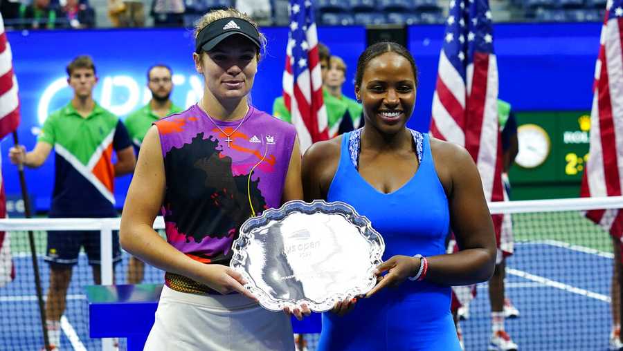 Taylor Townsend, of the United States, right, and Caty McNally, of the United States, pose with the runner-up trophy after being defeated by Barbora Krejcikova, of the Czech Republic, and Katerina Siniakova, of the Czech Republic in the final of the women&apos;s doubles at the U.S. Open tennis championships, Sunday, Sept. 11, 2022, in New York. (AP Photo/Matt Rourke)