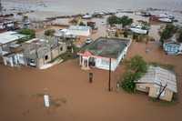 Homes are flooded on Salinas Beach after the passing of Hurricane Fiona in Salinas, Puerto Rico, Monday, Sept. 19, 2022.