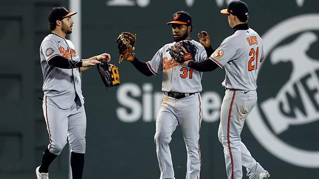 baltimore orioles outfielders, from left, ryan mckenna, cedric mullins and austin hays celebrate after defeating the boston red sox during the ninth inning of a baseball game, monday, sept. 26, 2022, in boston.