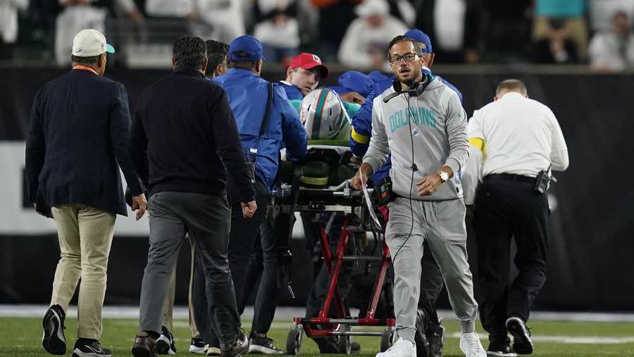Miami Dolphins head coach Mike McDaniel walks away as quarterback Tua Tagovailoa is taken off the field on a stretcher during the first half of an NFL football game against the Cincinnati Bengals, Thursday, Sept. 29, 2022, in Cincinnati. (AP Photo/Joshua A. Bickel)