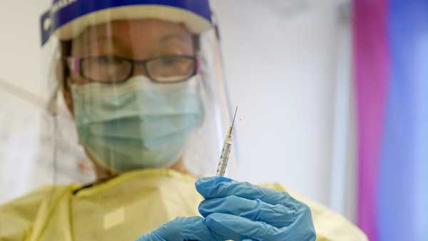 FILE - A physician assistant prepares a syringe with the monkeypox vaccine for a patient during a vaccination clinic Friday, Aug. 19, 2022, in New York.