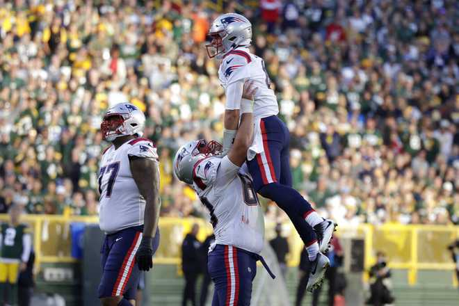 New England Patriots' DeVante Parker runs for a touchdown during the first  half of an NFL football game Sunday, Oct. 2, 2022, in Green Bay, Wis. (AP  Photo/Morry Gash Stock Photo - Alamy