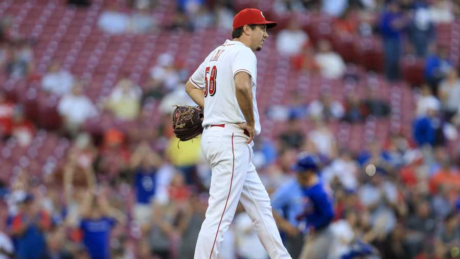 Cincinnati Reds&apos; Derek Law reacts after allowing a three-run home run to Chicago Cubs&apos; Zach McKinstry during the sixth inning of a baseball game in Cincinnati, Friday, Wednesday, Oct. 5, 2022. (AP Photo/Aaron Doster)