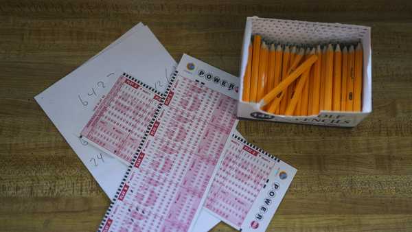 Two Powerball playslips sit on top of a piece of scratch paper at Bluebird Liquor in Hawthorne, Calif., Wednesday, Nov. 2, 2022. The fourth-largest lottery jackpot in U.S. history could soar to the largest ever if no one wins the top prize in Wednesday night's Powerball drawing. (AP Photo/Jae C. Hong)