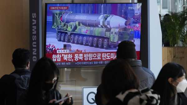 A TV screen shows a file image of North Korean missile in a military parade during a news program at the Seoul Railway Station in Seoul, South Korea, Friday, Nov. 18, 2022. South Korea says the missile North Korea launched Friday morning is likely an intercontinental ballistic missile. (AP Photo/Ahn Young-joon)