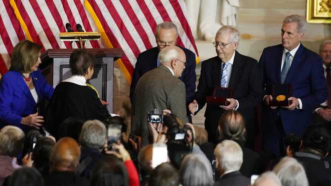 Charles&#x20;and&#x20;Gladys&#x20;Sicknick,&#x20;father&#x20;and&#x20;mother&#x20;of&#x20;slain&#x20;U.S.&#x20;Capitol&#x20;Police&#x20;Officer&#x20;Brian&#x20;Sicknick,&#x20;are&#x20;greeted&#x20;by&#x20;Senate&#x20;Majority&#x20;Leader&#x20;Chuck&#x20;Schumer&#x20;of&#x20;N.Y.,&#x20;center,&#x20;with&#x20;Senate&#x20;Minority&#x20;Leader&#x20;Mitch&#x20;McConnell&#x20;of&#x20;Ky.,&#x20;and&#x20;House&#x20;Minority&#x20;Leader&#x20;Kevin&#x20;McCarthy&#x20;of&#x20;Calif.,&#x20;at&#x20;right,&#x20;during&#x20;a&#x20;Congressional&#x20;Gold&#x20;Medal&#x20;ceremony&#x20;honoring&#x20;law&#x20;enforcement&#x20;officers&#x20;who&#x20;defended&#x20;the&#x20;U.S.&#x20;Capitol&#x20;on&#x20;Jan.&#x20;6,&#x20;2021,&#x20;in&#x20;the&#x20;U.S.&#x20;Capitol&#x20;Rotunda&#x20;in&#x20;Washington,&#x20;Tuesday,&#x20;Dec.&#x20;6,&#x20;2022.&#x20;The&#x20;members&#x20;of&#x20;the&#x20;Sicknick&#x20;family&#x20;declined&#x20;to&#x20;shake&#x20;hands&#x20;with&#x20;McConnell&#x20;and&#x20;McCarthy.&#x20;At&#x20;left&#x20;is&#x20;U.S.&#x20;Capitol&#x20;Police&#x20;Chief&#x20;Thomas&#x20;Manger&#x20;and&#x20;House&#x20;Speaker&#x20;Nancy&#x20;Pelosi&#x20;of&#x20;Calif.&#x20;&#x28;AP&#x20;Photo&#x2F;Carolyn&#x20;Kaster&#x29;