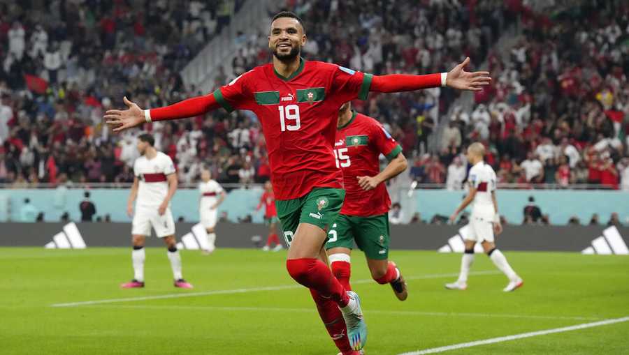 Morocco&apos;s Youssef En-Nesyri celebrates after scoring his side&apos;s first goal during the World Cup quarterfinal soccer match between Morocco and Portugal, at Al Thumama Stadium in Doha, Qatar, Saturday, Dec. 10, 2022. (AP Photo/Martin Meissner)