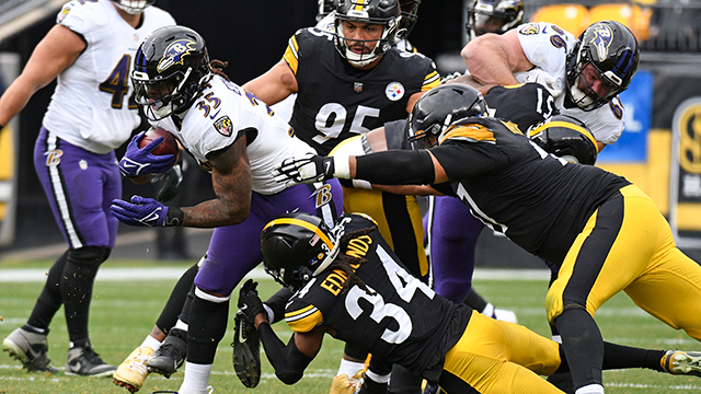 baltimore ravens running back gus edwards (35) is tackled by pittsburgh steelers safety terrell edmunds (34) during the first half of an nfl football game in pittsburgh, sunday, dec. 11, 2022.