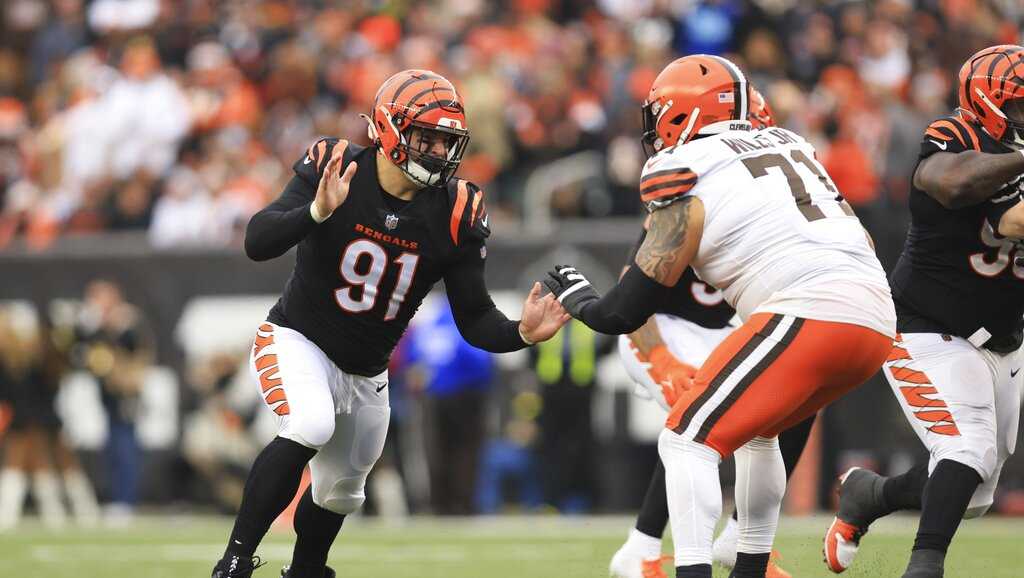 Cincinnati Bengals defensive end Trey Hendrickson (91) is led off the field  after being injured against the Pittsburgh Steelers during the first half  of an NFL football game, Sunday, Nov. 20, 2022