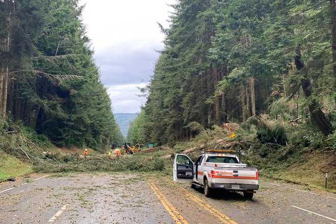 In&#x20;this&#x20;photo&#x20;provided&#x20;by&#x20;Caltrans&#x20;District&#x20;1,&#x20;crews&#x20;work&#x20;at&#x20;removing&#x20;multiple&#x20;fallen&#x20;trees&#x20;blocking&#x20;U.S.&#x20;Highway&#x20;101&#x20;in&#x20;Humboldt&#x20;County&#x20;near&#x20;Trinidad,&#x20;Calif.,&#x20;Wednesday,&#x20;Jan.&#x20;4,&#x20;2023.&#x20;A&#x20;major&#x20;winter&#x20;storm&#x20;approached&#x20;California&#x20;on&#x20;Wednesday&#x20;causing&#x20;crews&#x20;to&#x20;rush&#x20;to&#x20;clear&#x20;storm&#x20;drains&#x20;in&#x20;preparation&#x20;for&#x20;flooding&#x20;and&#x20;strong&#x20;winds,&#x20;as&#x20;parts&#x20;of&#x20;the&#x20;Midwest&#x20;dealt&#x20;with&#x20;snow,&#x20;ice&#x20;or&#x20;tornadoes,&#x20;and&#x20;the&#x20;South&#x20;recovered&#x20;from&#x20;strong&#x20;overnight&#x20;storms.&#x20;&#x28;Caltrans&#x20;District&#x20;1&#x20;via&#x20;AP&#x29;