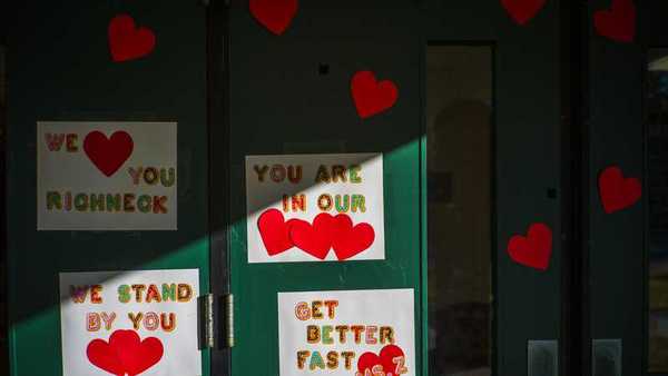 Messages of support for teacher Abby Zwerner, who was shot by a 6-year-old student, grace the front door of Richneck Elementary School Newport News, Va. on Monday, Jan. 9, 2023. (AP Photo/John C. Clark)