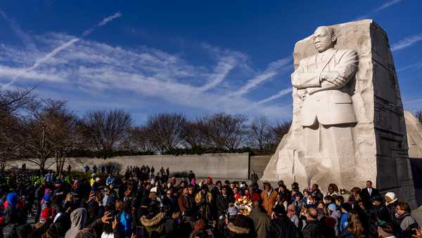 A large group gathers to watch a wreath-laying ceremony at the Martin Luther King Jr. Memorial on Martin Luther King Jr. Day in Washington, Monday, Jan. 16, 2023. (AP Photo/Andrew Harnik)