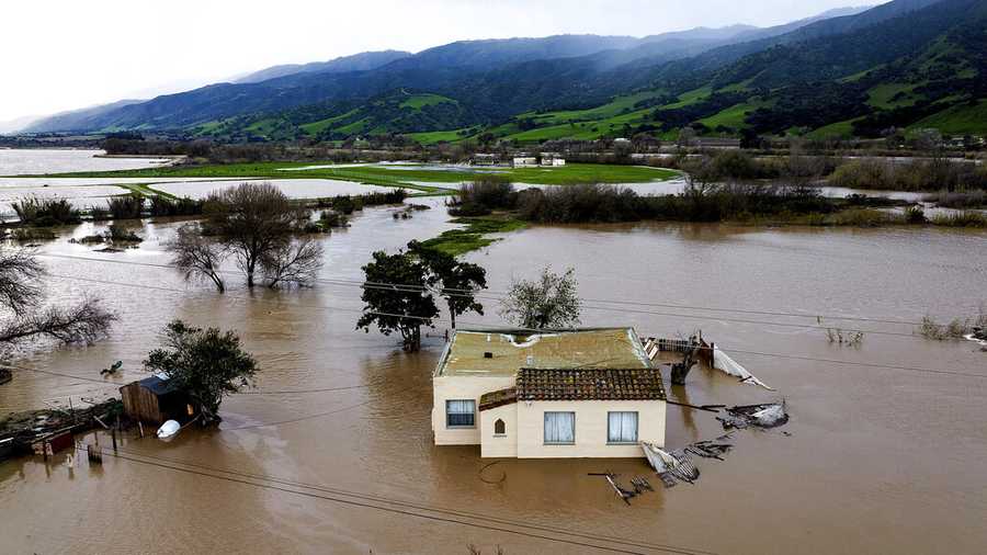 FILE - Floodwaters surround a home in the Chualar community of Monterey County, Calif., as the Salinas River overflows its banks, Jan. 13, 2023. A new study says the drenching that California has been getting since Christmas will only get wetter and nastier with climate change. (AP Photo/Noah Berger, File)