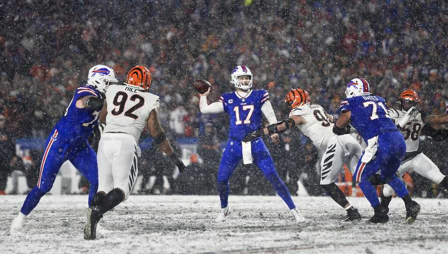 Buffalo Bills quarterback Josh Allen (17) passes against the Cincinnati Bengals during the fourth quarter of an NFL division round football game, Sunday, Jan. 22, 2023, in Orchard Park, N.Y. (AP Photo/Adrian Kraus)