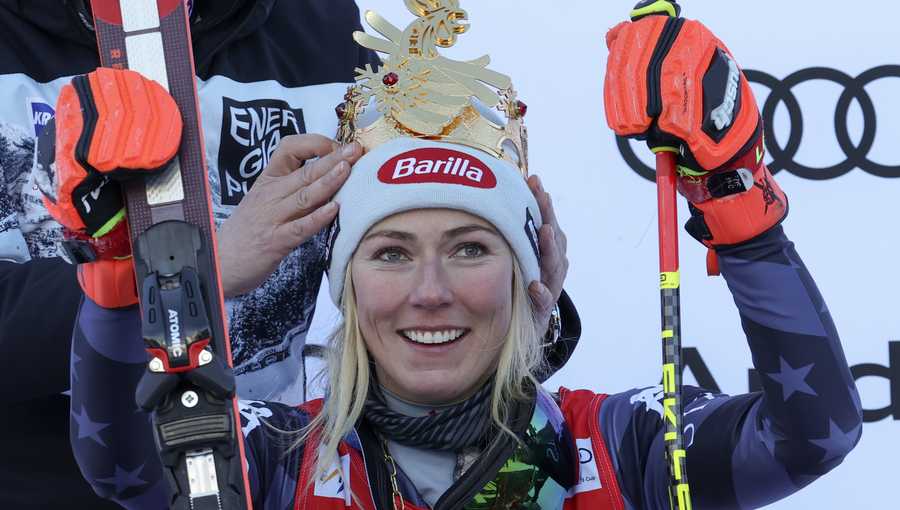 A crown is placed on United States&apos; Mikaela Shiffrin&apos;s head after she won an alpine ski, women&apos;s World Cup giant slalom, in Kronplatz, Italy, Wednesday, Jan. 25, 2023. A day after securing record victory No. 83, Shiffrin added her 84th win on Wednesday in another giant slalom on the same course. (AP Photo/Alessandro Trovati)