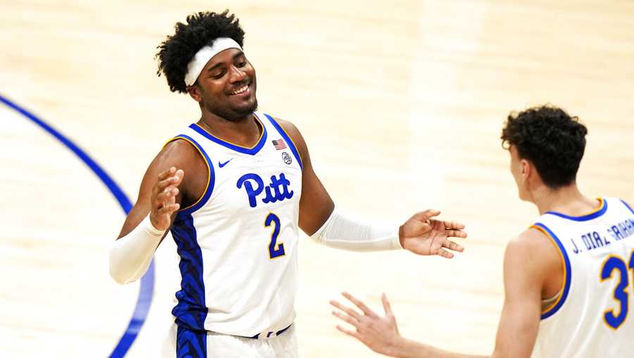 Pittsburgh forward Blake Hinson (2) celebrates with Pittsburgh center Federiko Federiko (33) as time runs out in a 81-79 Pitt win over Wake Forest in an NCAA college basketball game in Pittsburgh, Wednesday, Jan. 25, 2023. (AP Photo/Gene J. Puskar)
