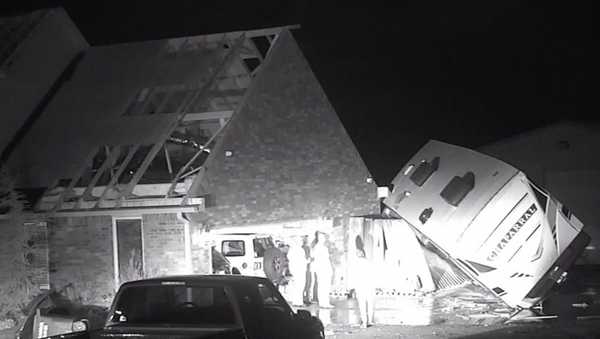 In this grab taken from video provided by KOCO, a view of the damage to a property after severe storms, in Shawnee, Oklahoma, late Sunday, Feb, 26, 2023. Powerful storms with widespread wind gusts and reported tornadoes swept across Oklahoma and Kansas, leaving more than a dozen people injured, and Michigan residents faced a fifth straight day Monday without power following last week's ice storm. (KOCO via AP)